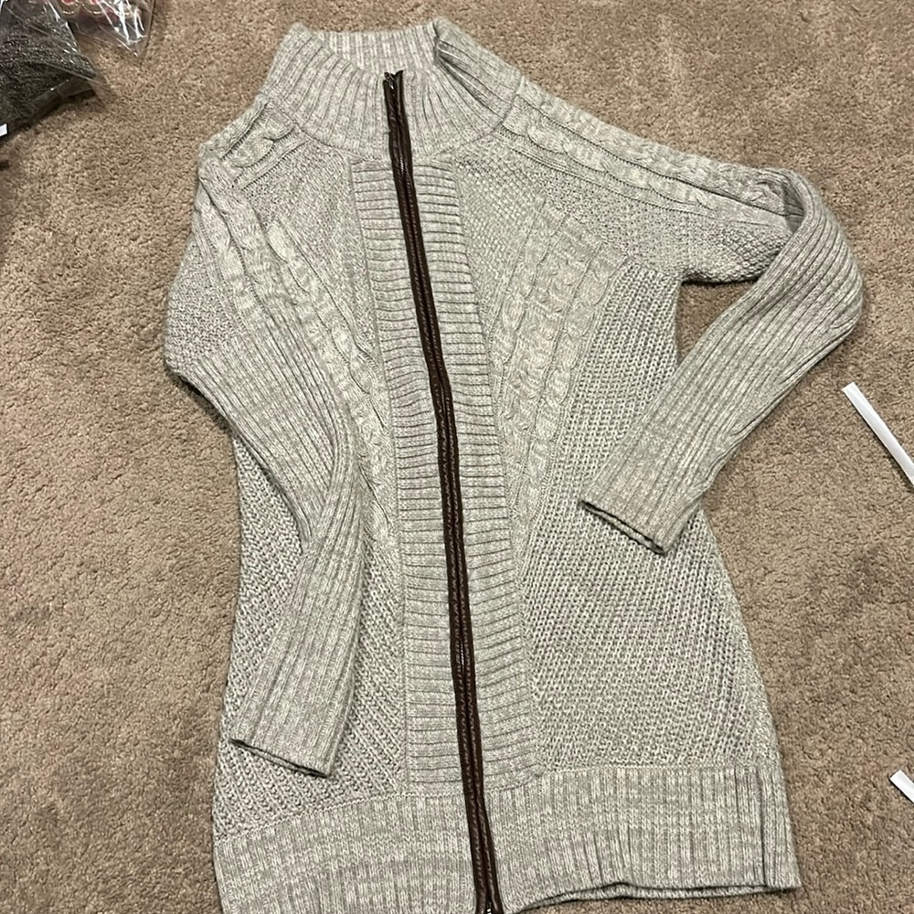 Venus cableknit sweater. Soft with leather detail along the zipper.